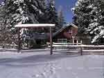 Picture of the ranch house in snow.